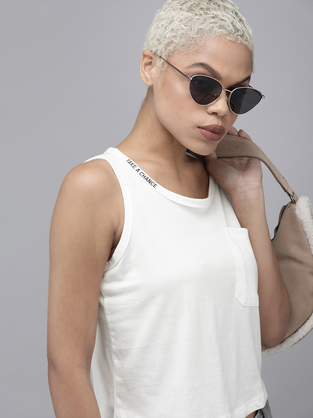 

Roadster Women White Solid Sleeveless Round-Neck T-shirt