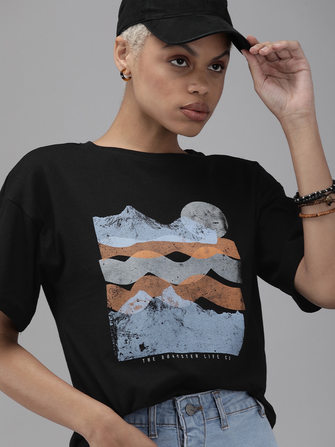

The Roadster Lifestyle Co Women Black Graphic Printed Extended Sleeves Pure Cotton T-shirt