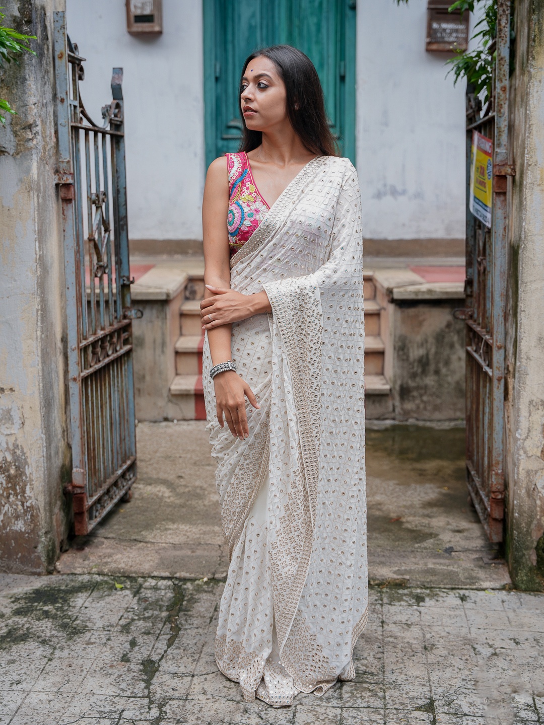 

Suta White & Silver Embellished Mirror Work Rayon Saree