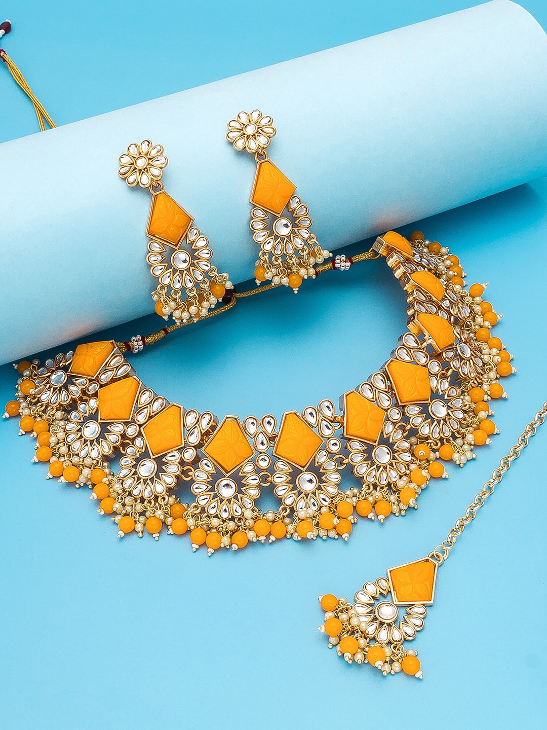 

aadita Gold-Plated White & Yellow Stone-Studded Temple Jewellery Set