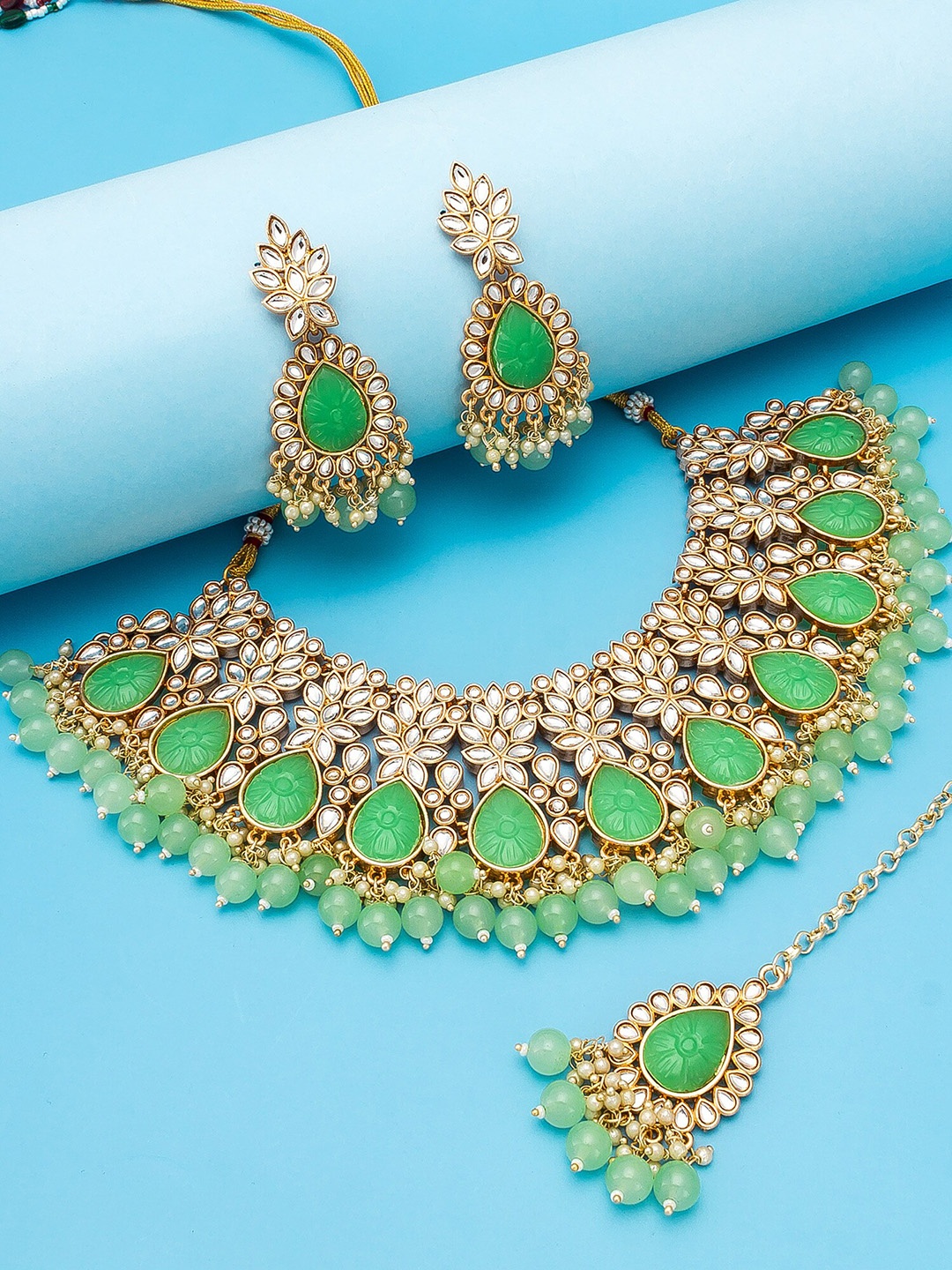 

aadita Gold-Plated White & Green Stone-Studded & Pearl Beaded Temple Jewellery Set