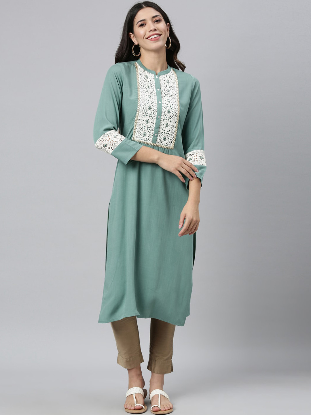 

Neerus Women Sea Green Geometric Embroidered Mirror Work Kurta
