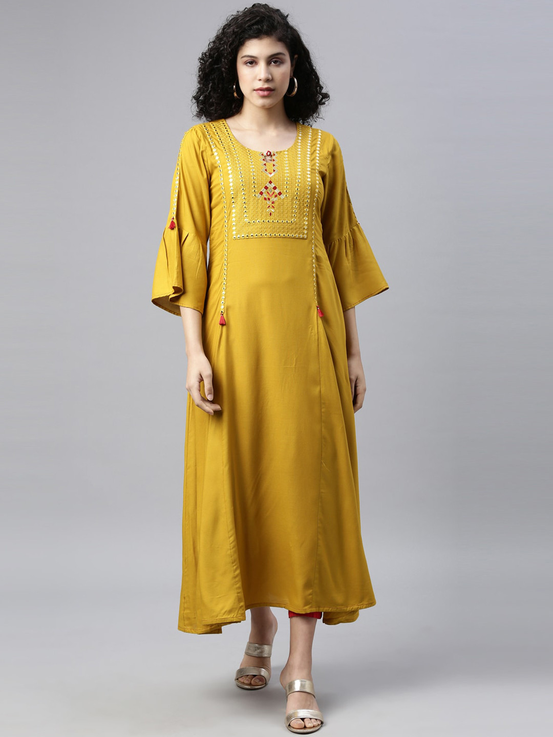 

Neerus Women Mustard Yellow Geometric Yoke Design Flared Sleeves Thread Work Kurta