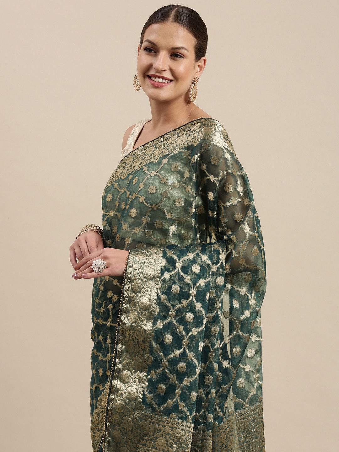 

Geroo Jaipur Green & Silver Floral Zari Organza Banarasi Saree