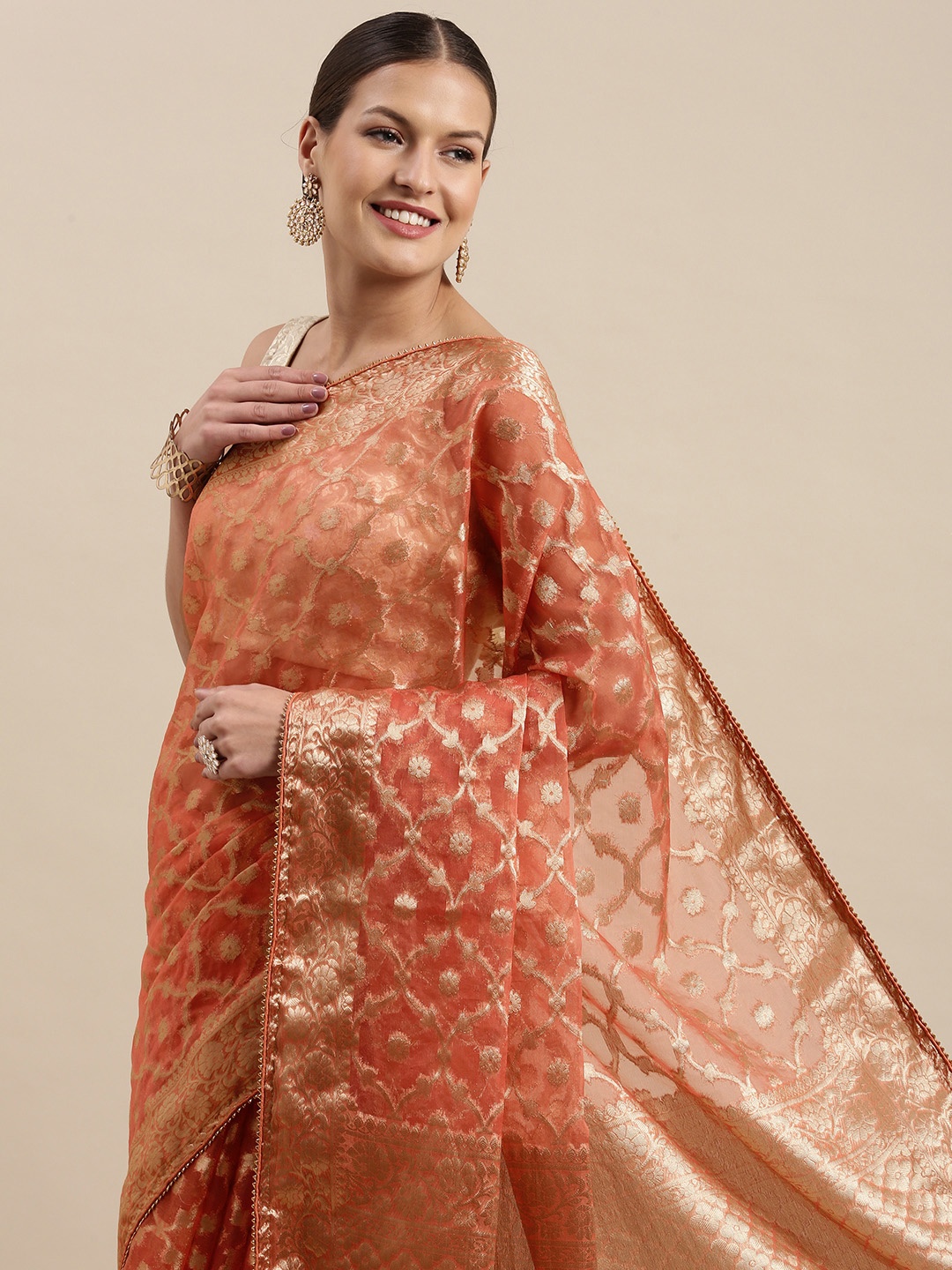

Geroo Jaipur Peach-Coloured & Golden Floral Zari Organza Banarasi Saree