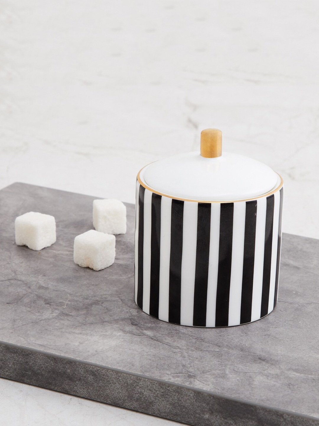 

Home Centre White & Black Striped Sugar Pot