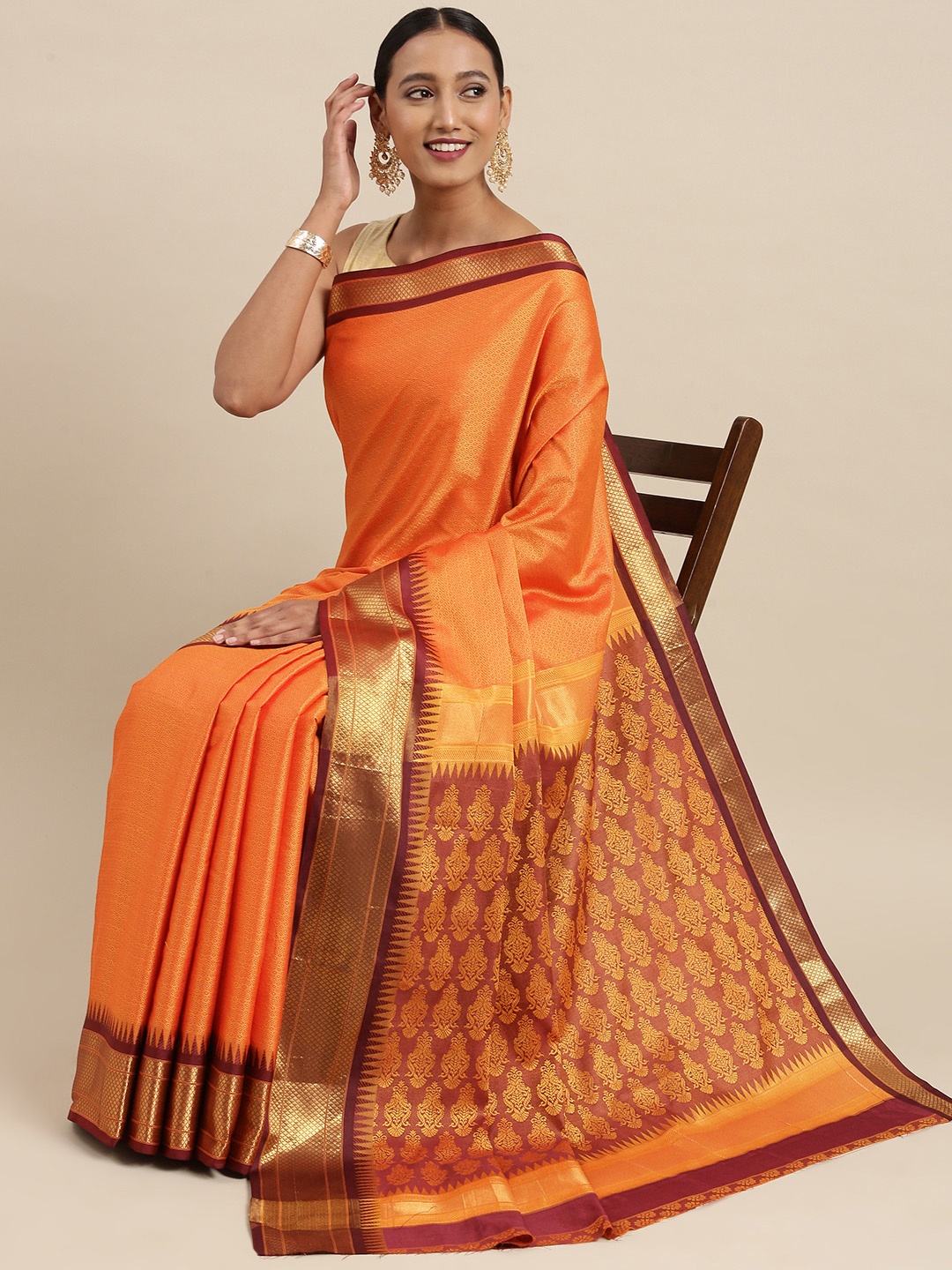 

Mitera Orange & Golden Ethnic Motif Woven Design Saree