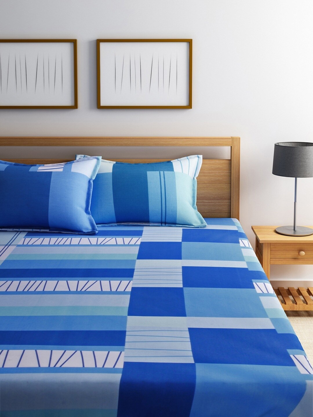 

Dreamscape Blue Geometric Printed 144 TC King Size Bedsheet With 2 Pillow Covers
