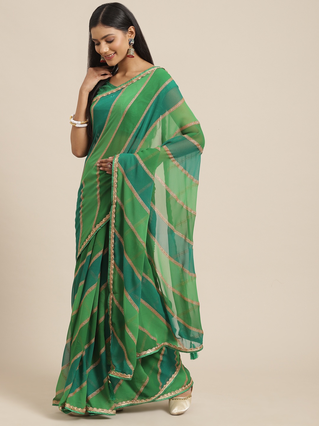 

Triveni Green Gotta Patti Embellished Pure Georgette Leheriya Saree