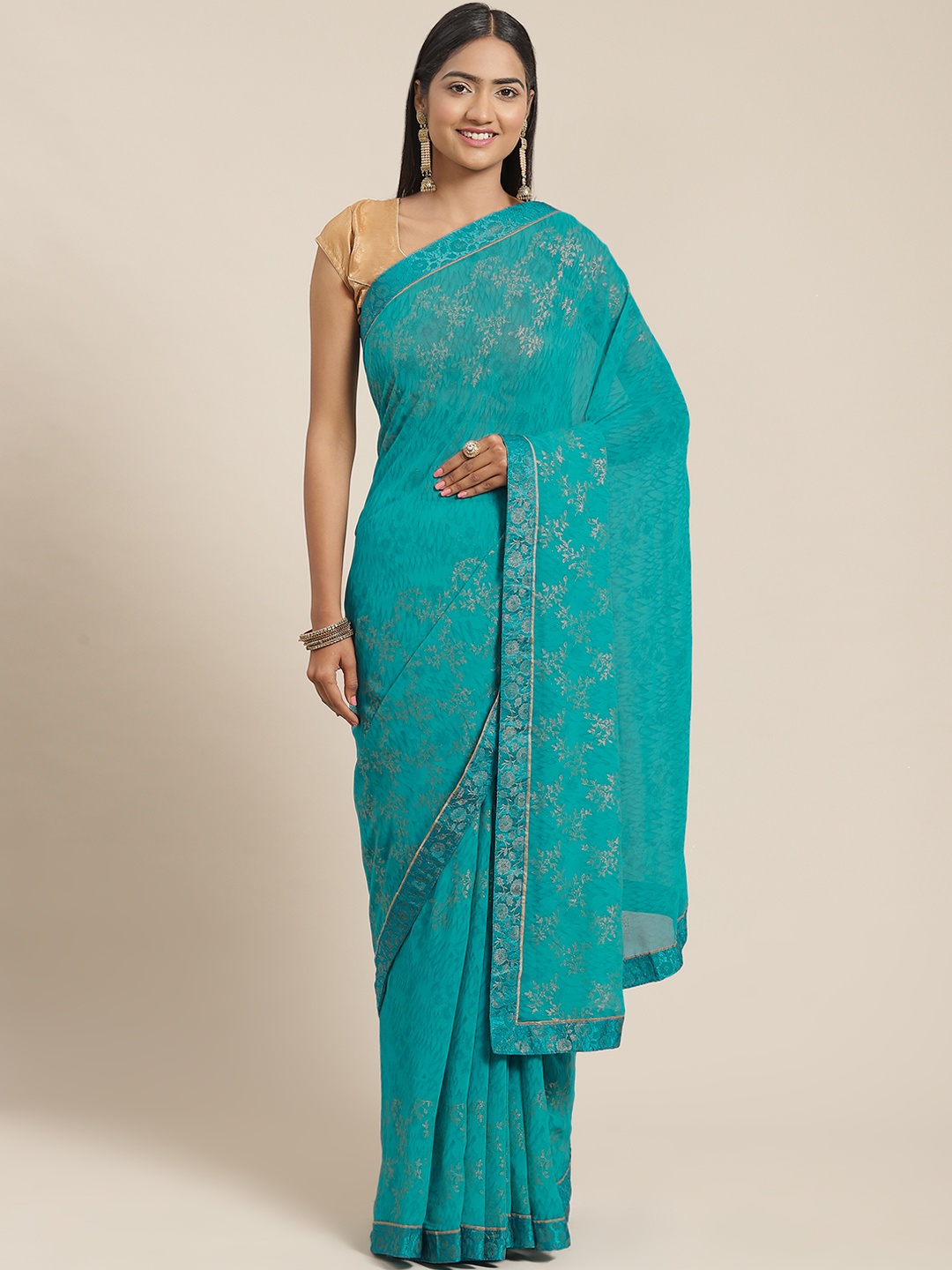 

Triveni Green Floral Zari Pure Georgette Saree
