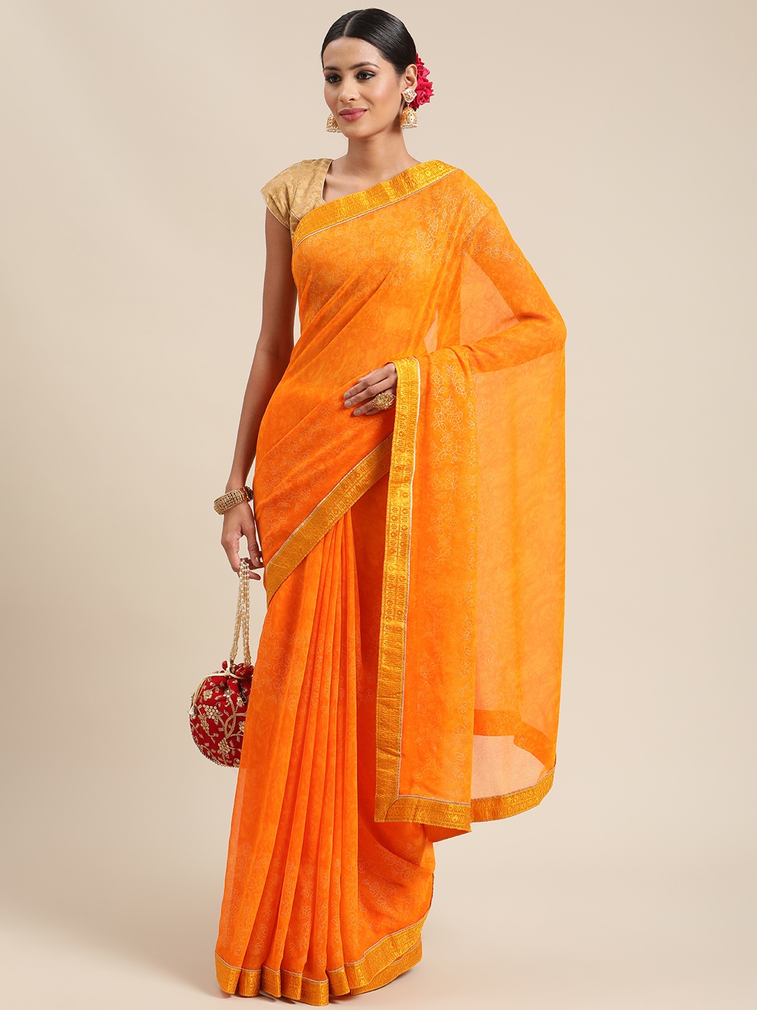 

Triveni Orange Zari Pure Georgette Saree
