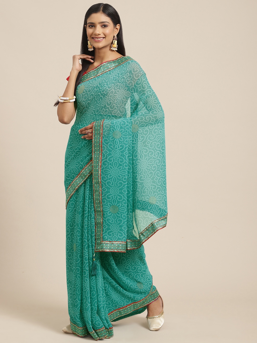 

Triveni Sea Green Bandhani Printed Zari Pure Georgette Bandhani Saree