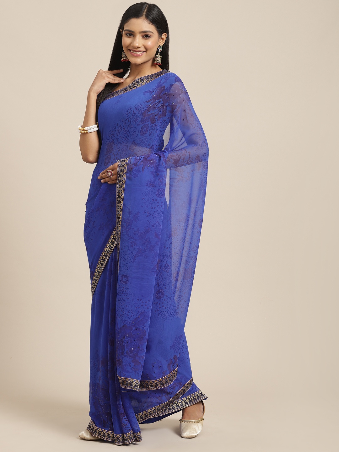 

Triveni Blue Embellished Beads and Stones Pure Georgette Saree