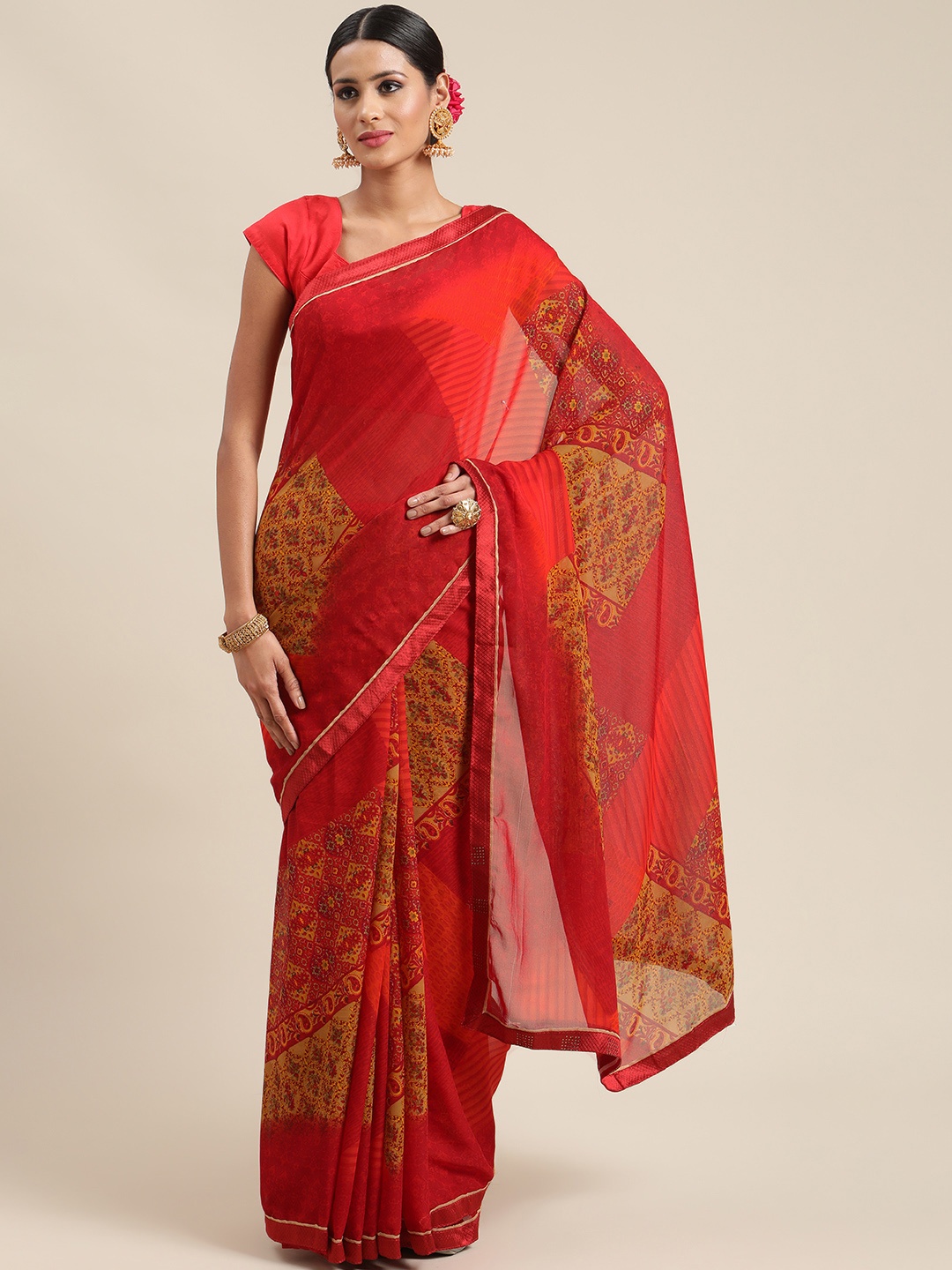 

Triveni Red Ethnic Motifs Saree