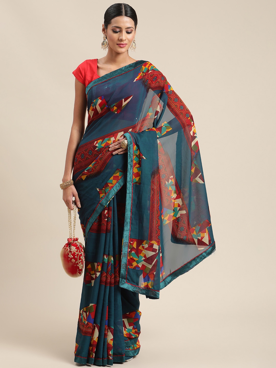 

Triveni Teal Printed Saree