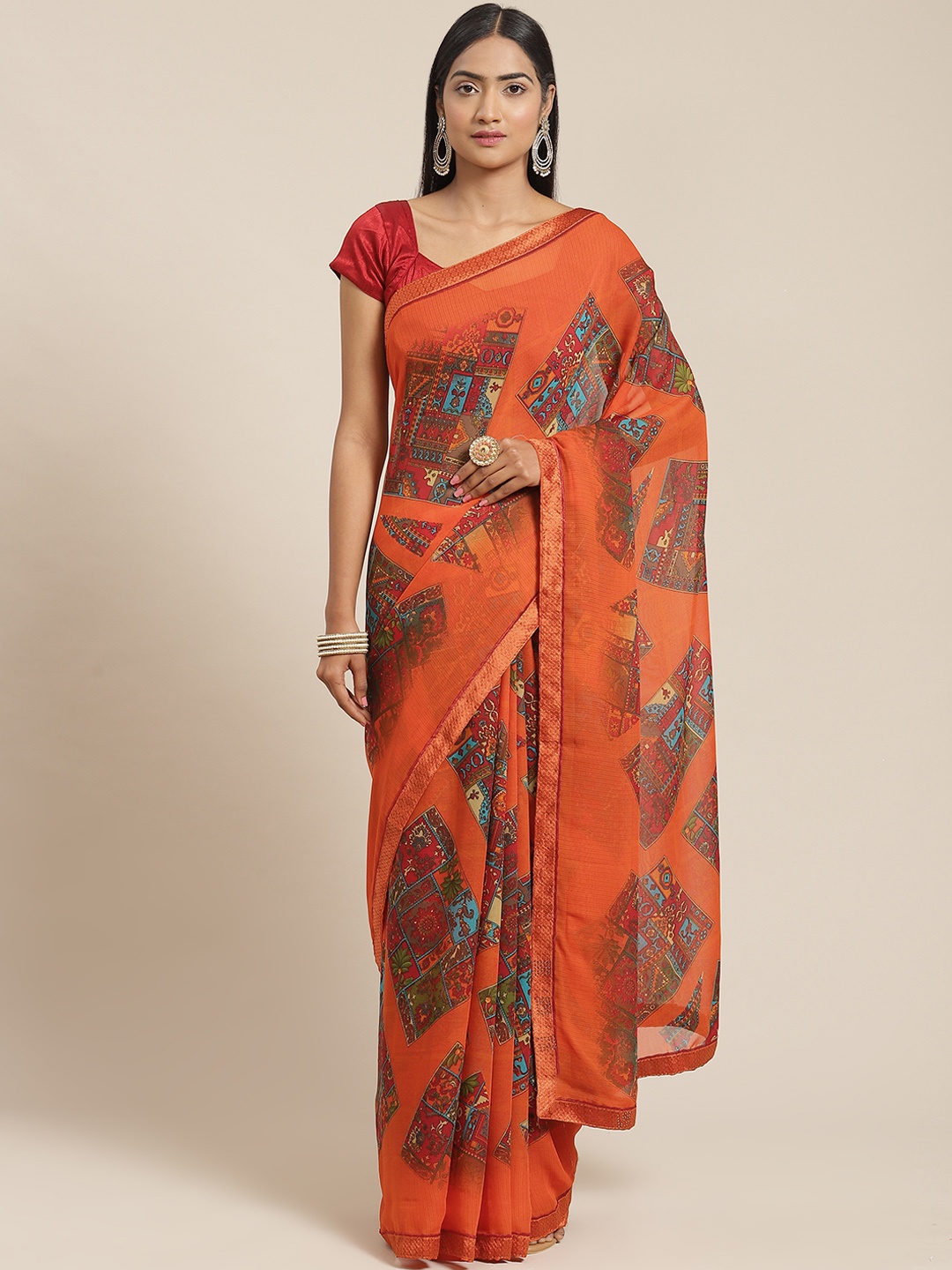 

Triveni Orange & Red Ethnic Motifs Printed Saree