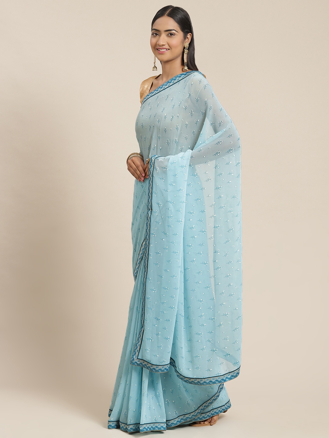 

Triveni Blue & White Floral Pure Georgette Saree