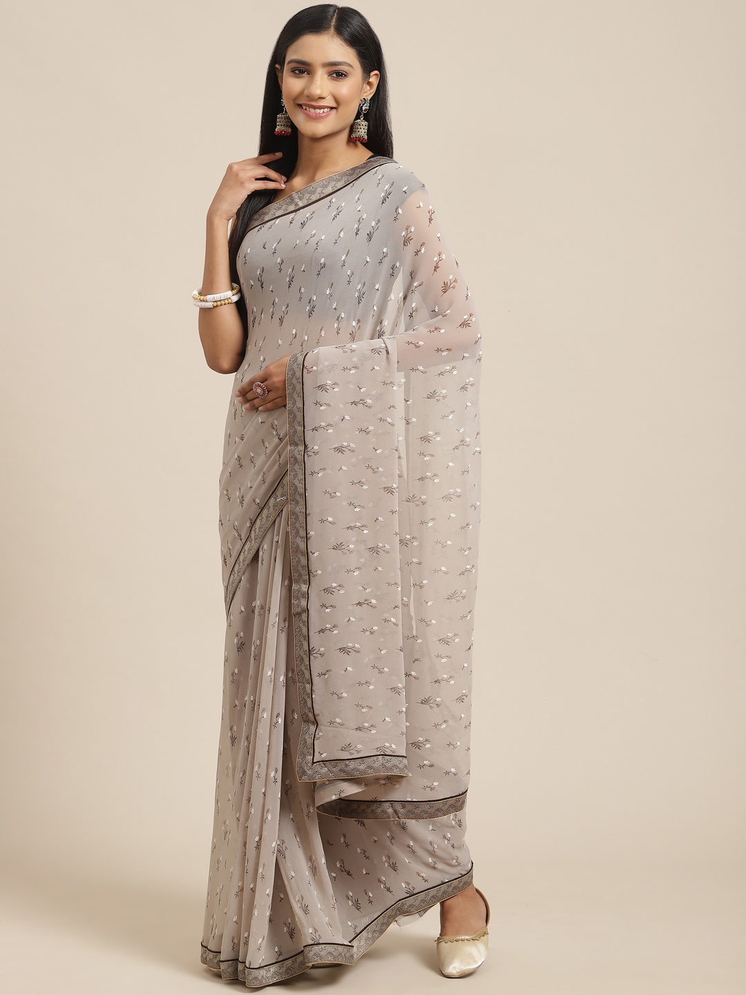 

Triveni Brown & White Floral Printed Pure Georgette Saree