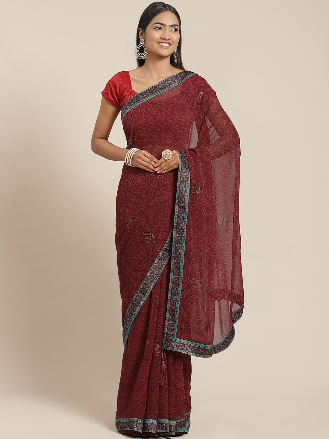 

Triveni Pink Bandhani Zari Pure Georgette Bandhani Saree