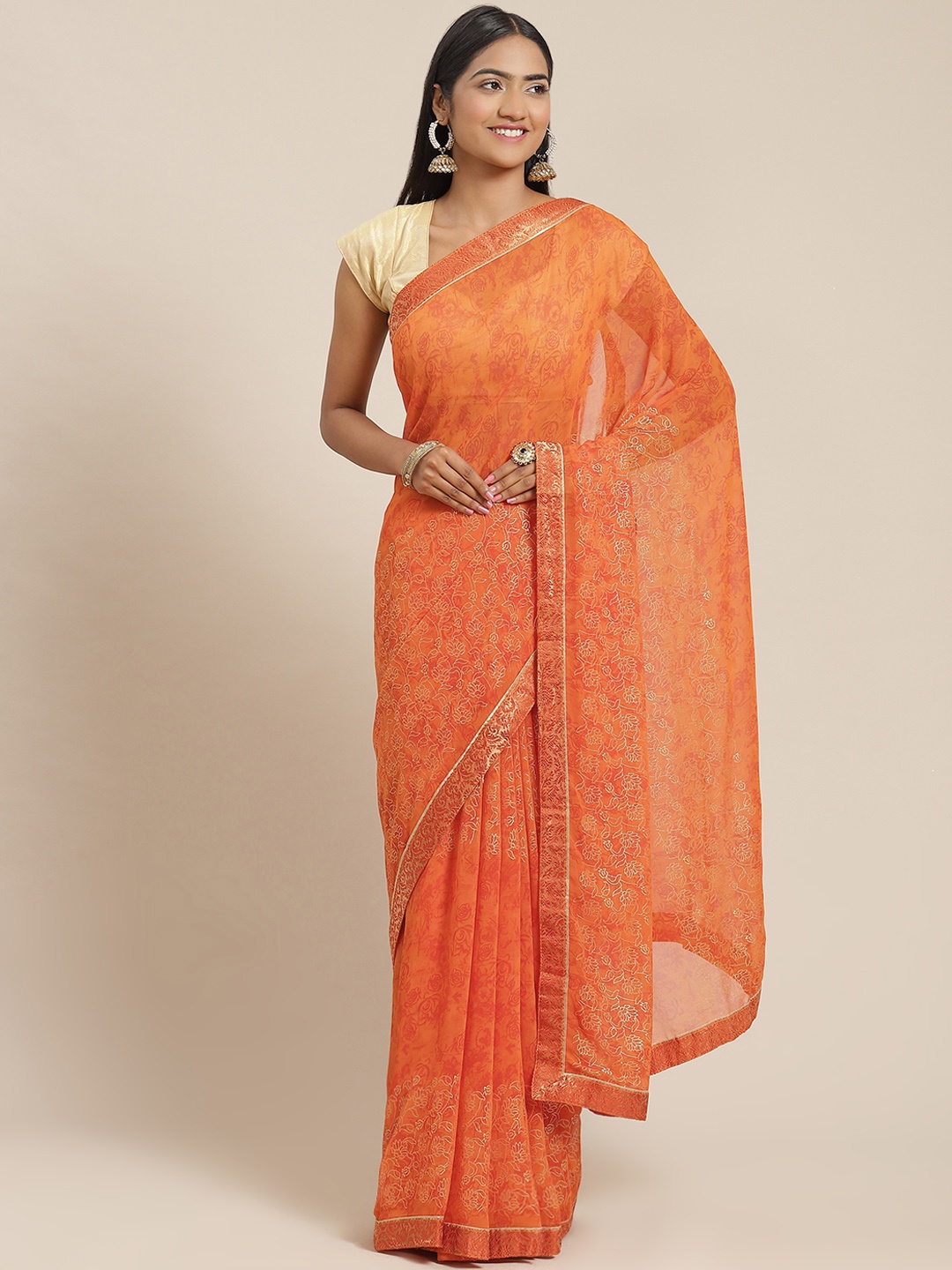 

Triveni Orange Floral Printed Zari Pure Georgette Saree