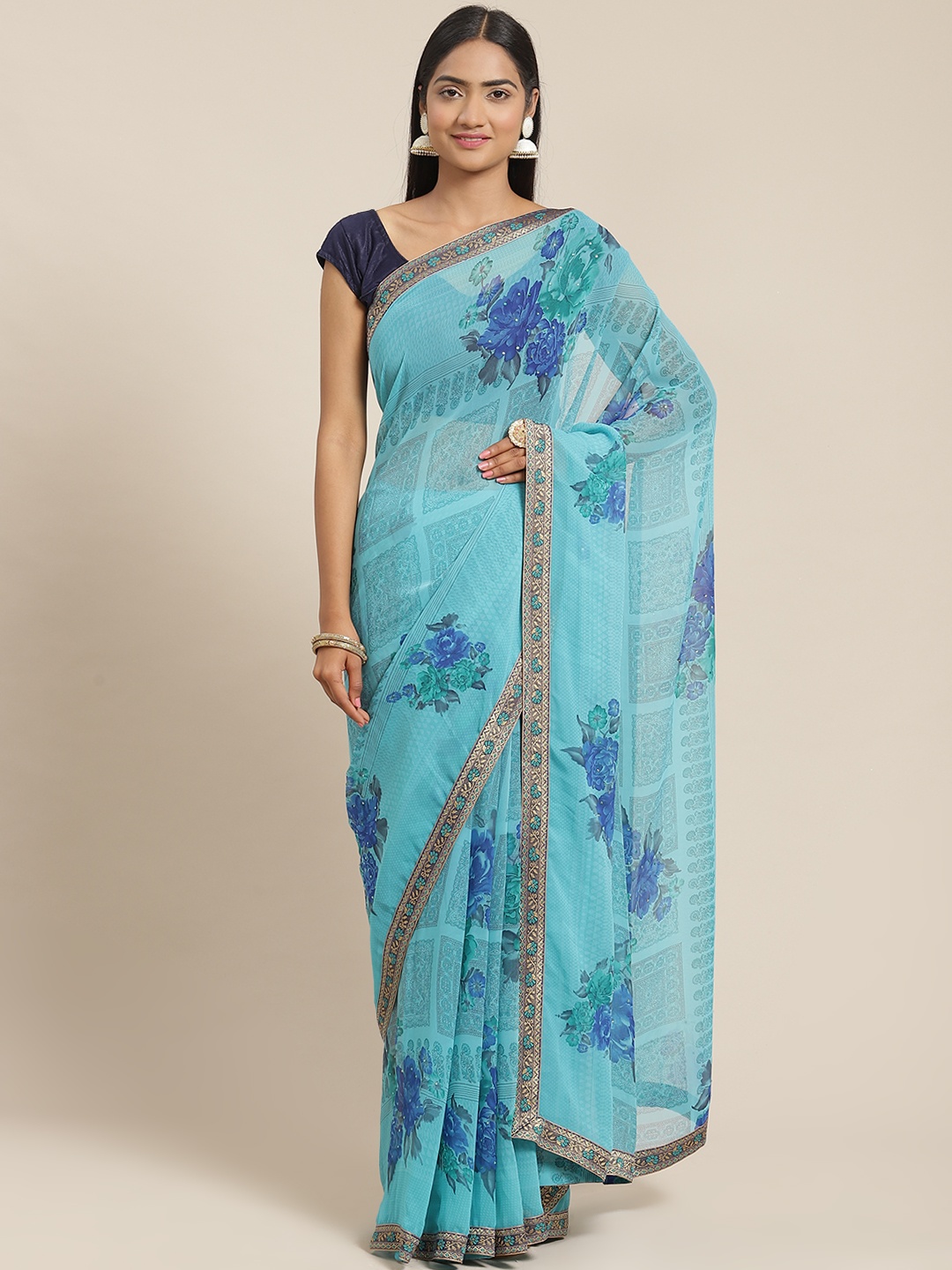 

Triveni Turquoise Blue Printed Beads and Stones Embellished Pure Georgette Saree