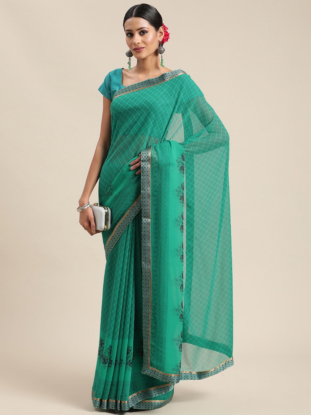 

Triveni Green Zari Pure Georgette Saree