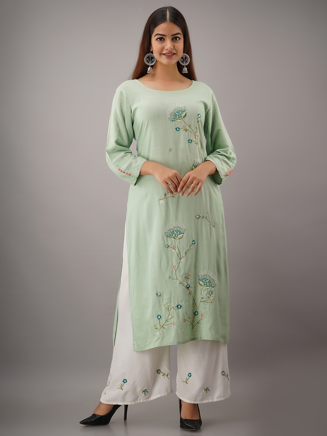 

KALINI Women Green Embroidered Panelled Kurti with Palazzos