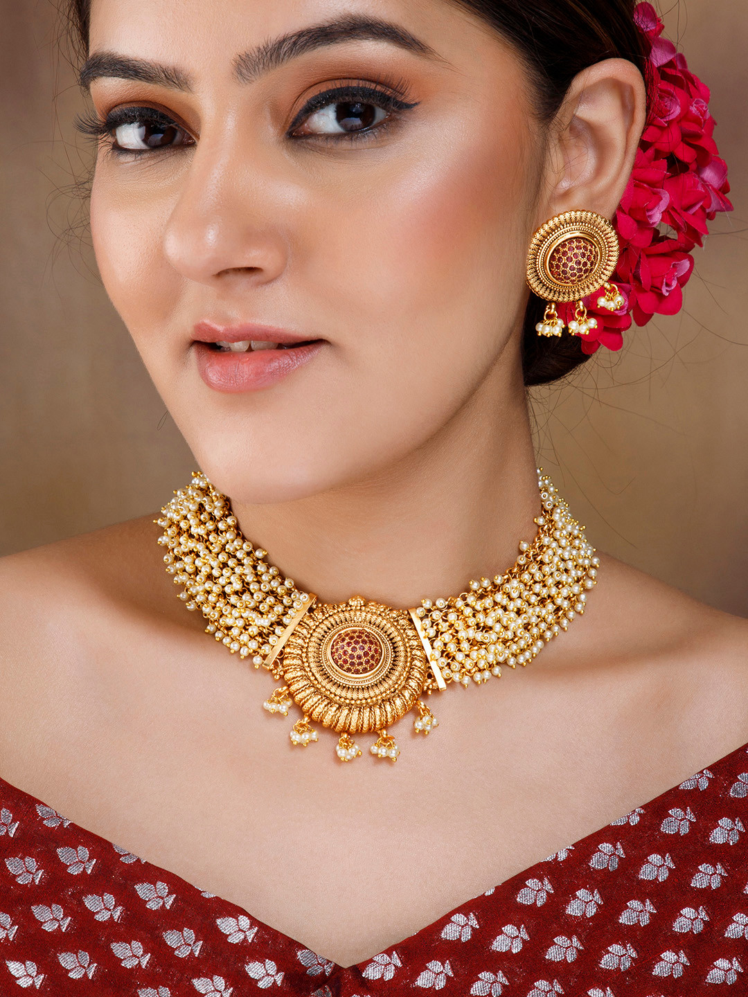 

Rubans 22K Gold Plated Ruby Studded & Pearl Beaded Handcrafted Choker Jewellery Set