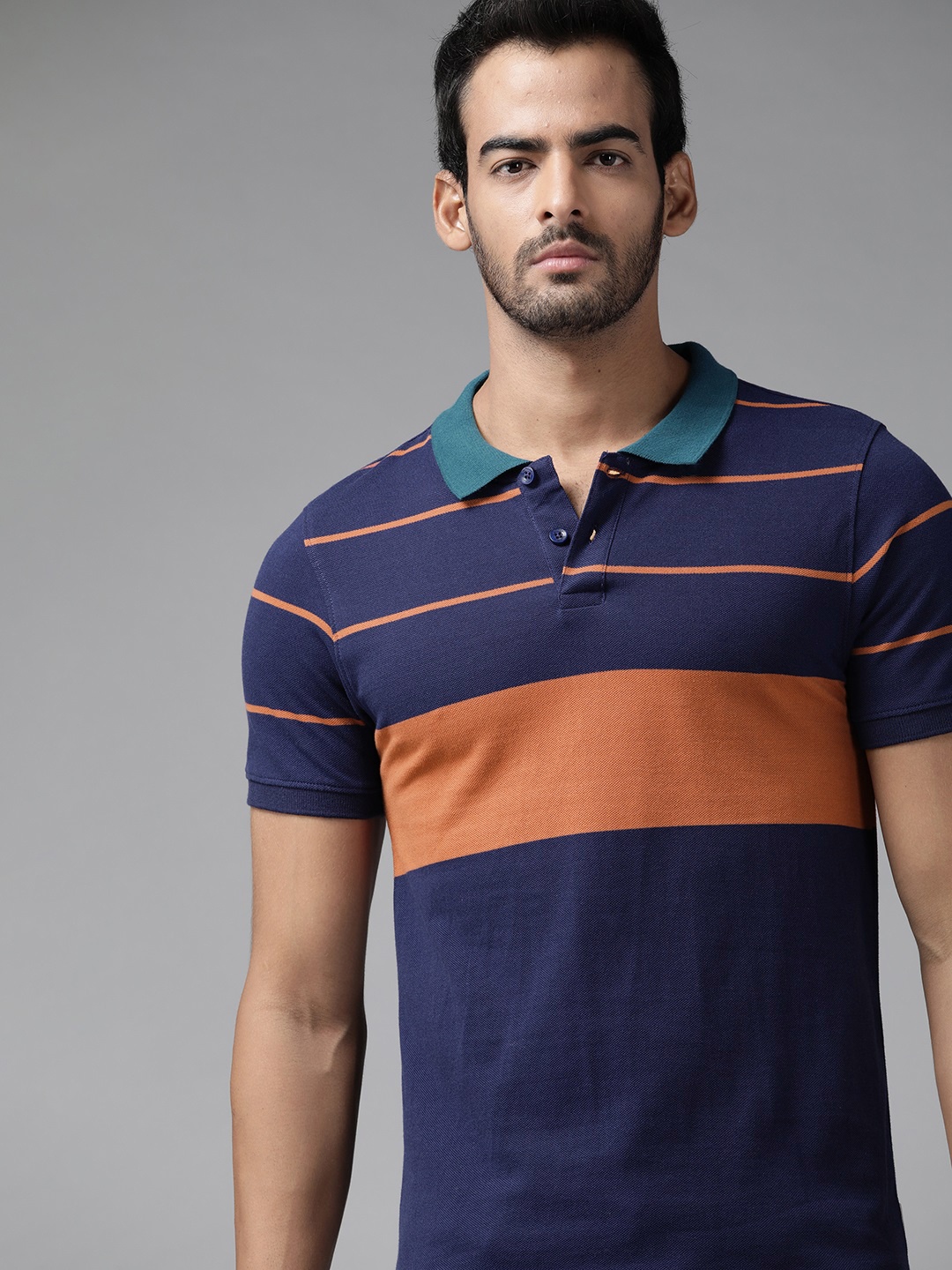 

Roadster Men Navy Blue & Rust Red Striped Polo Collar Pure Cotton T-shirt