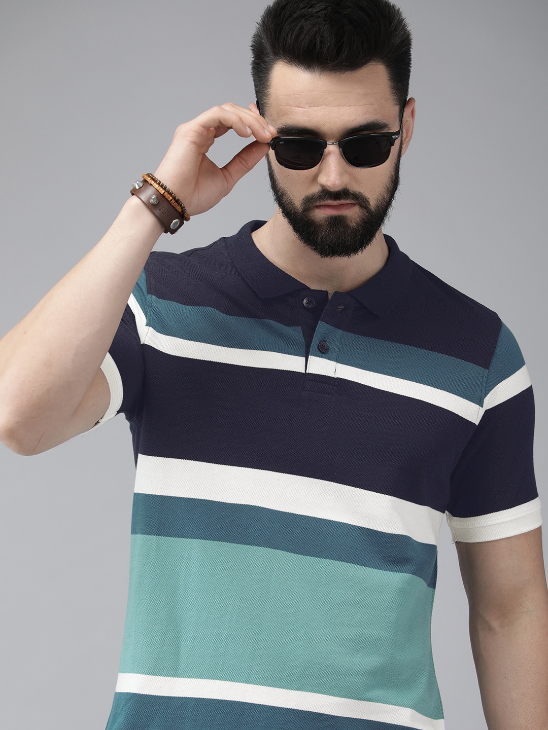 

Roadster Men Navy Blue & White Multi Or Variegated Stripes Polo Collar Pure Cotton T-shirt