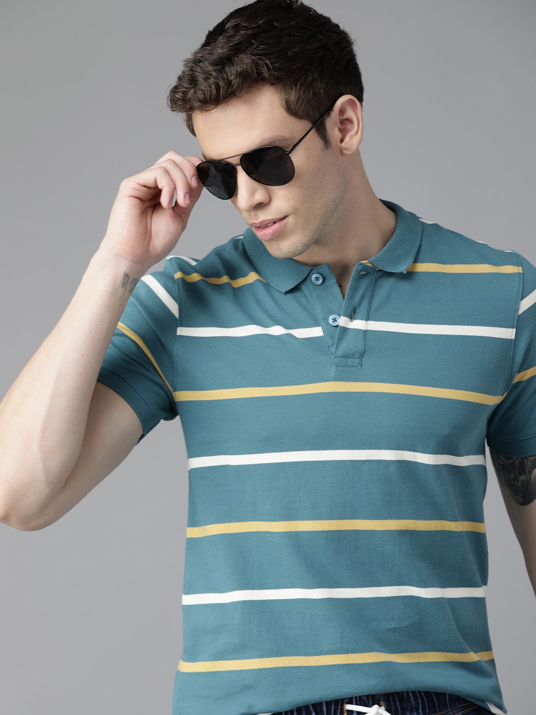 

Roadster Men Blue & White Striped Polo Collar Pure Cotton T-shirt