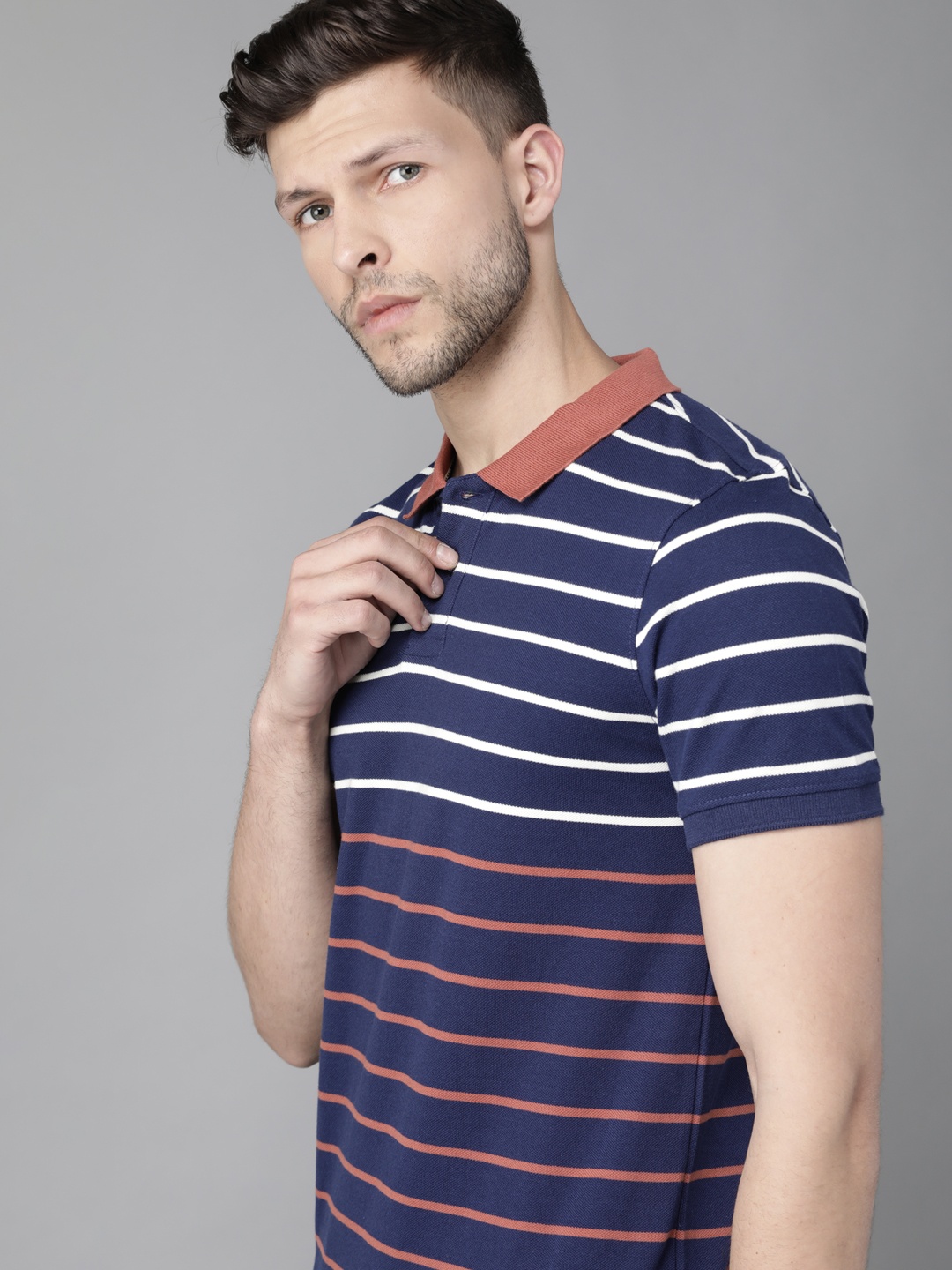 

Roadster Men Navy Blue & Rust Red Striped Polo Collar Pure Cotton T-shirt