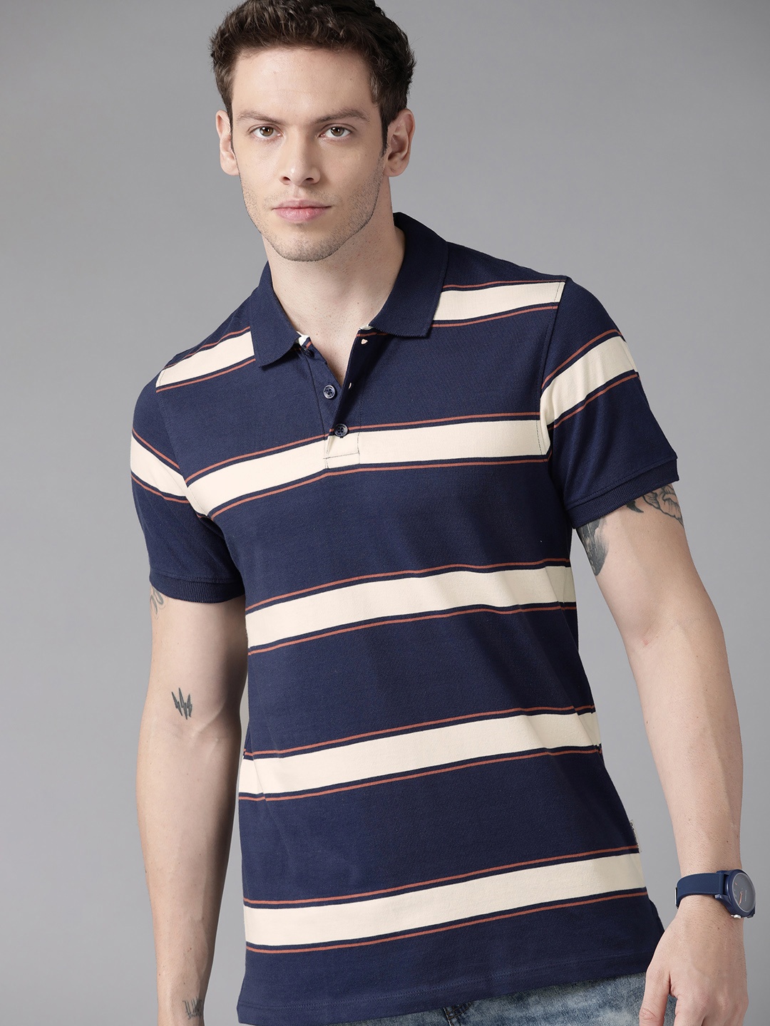 

Roadster Men Navy Blue & Off White Striped Polo Collar Pure Cotton T-shirt