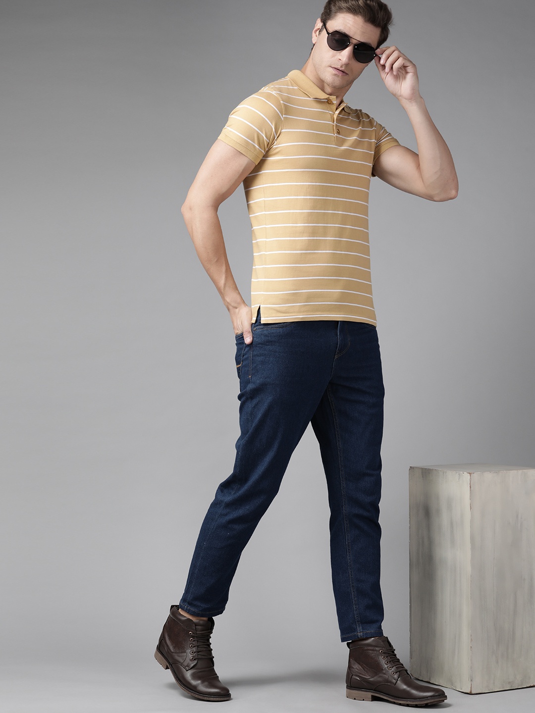 

The Roadster Lifestyle Co Men Khaki & White Pure Cotton Striped Polo Collar T-shirt