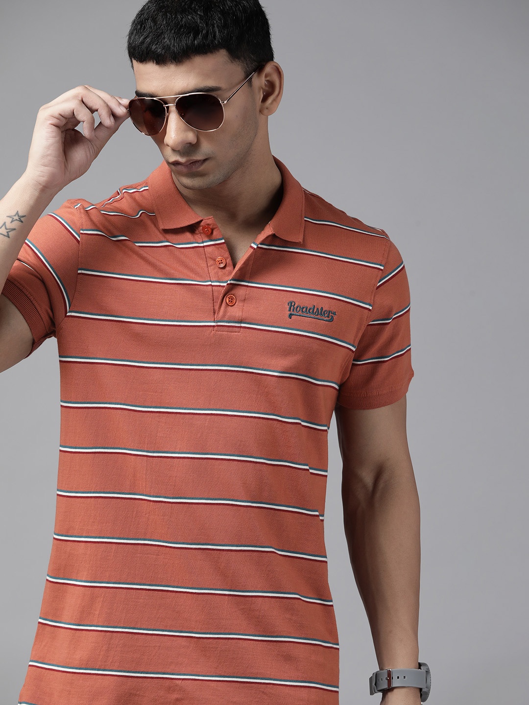 

Roadster Men Rust Red Striped Polo Collar Pure Cotton T-shirt