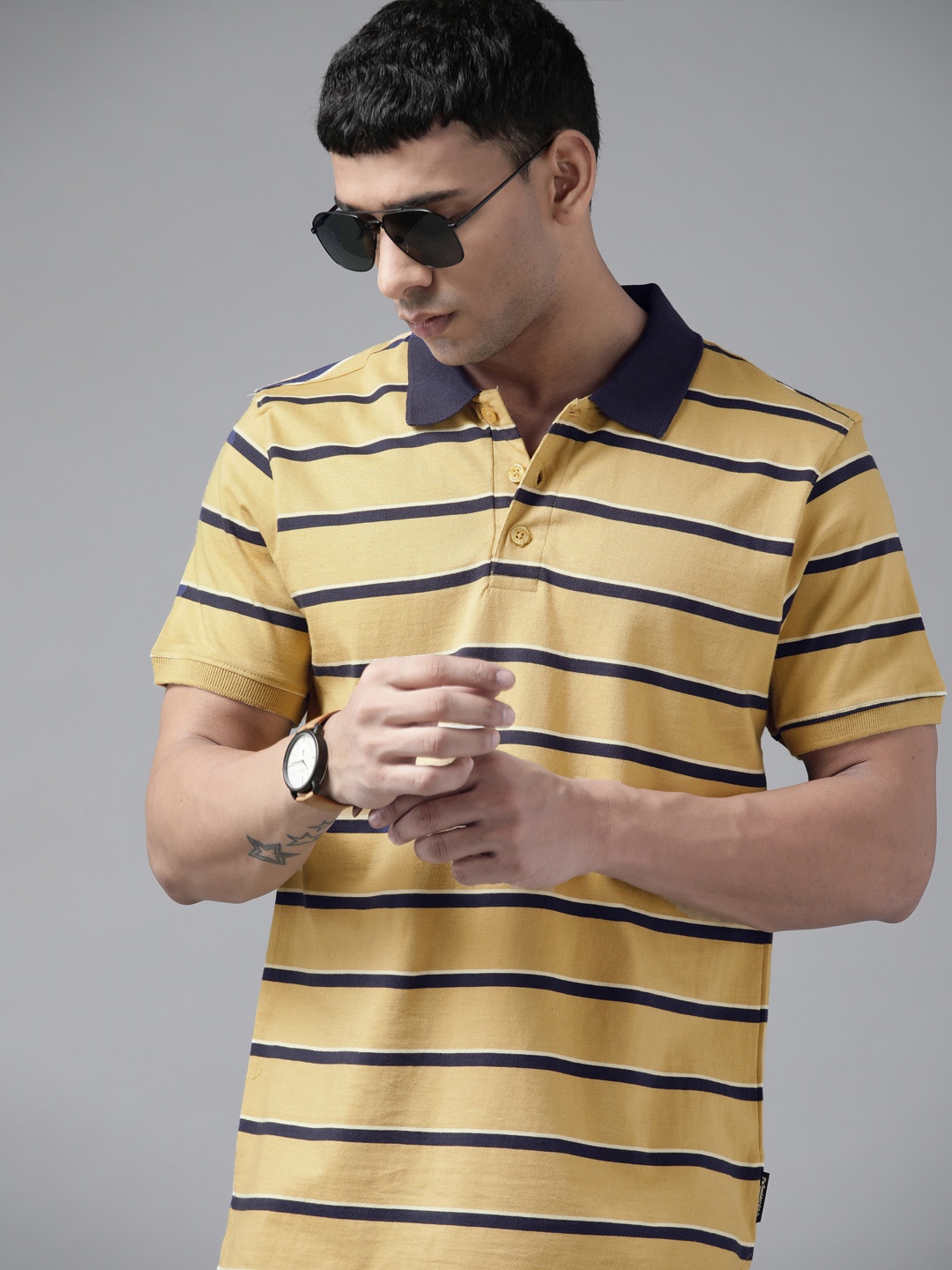 

Roadster Men Khaki & Navy Blue Striped Polo Collar Pure Cotton T-shirt