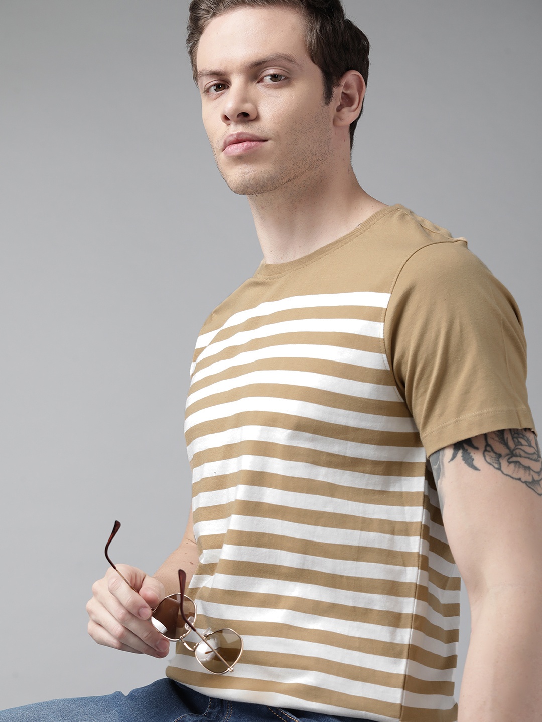 

Roadster Men Khaki & White Striped Pure Cotton T-shirt