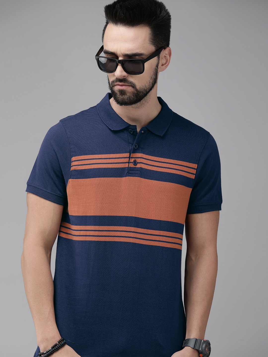 

Roadster Men Navy Blue & Brown Striped Polo Collar T-shirt
