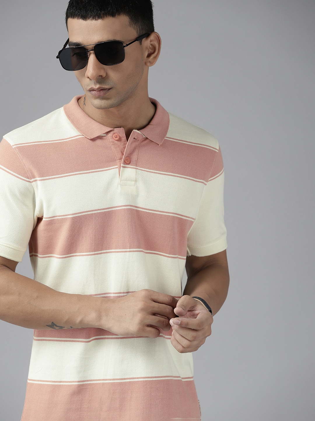 

Roadster Men Pink & Off White Striped Polo Collar T-shirt