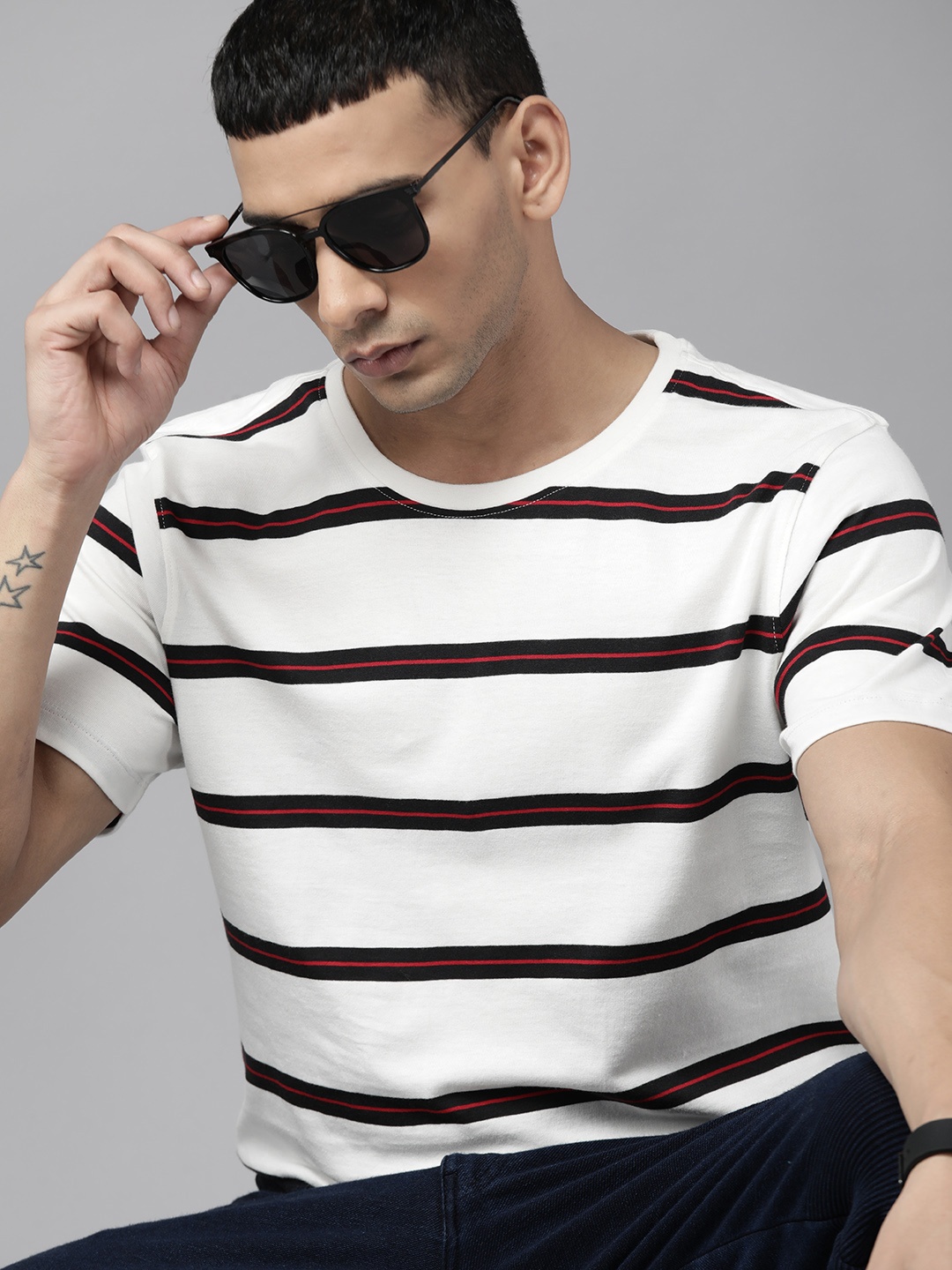 

The Roadster Lifestyle Co. Men White & Black Striped Pure Cotton T-shirt