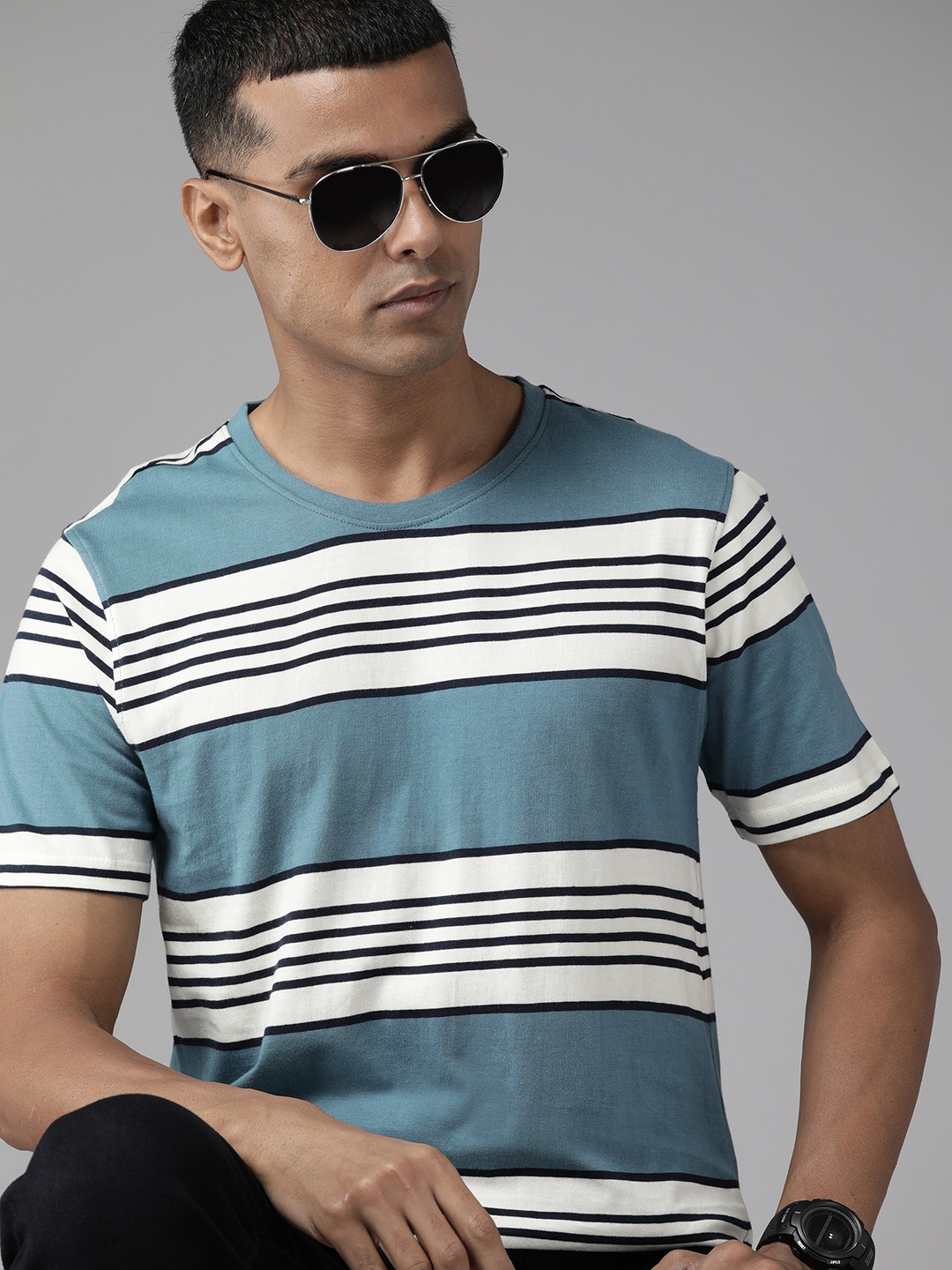 

Roadster Men Teal Blue & White Striped Pure Cotton T-shirt
