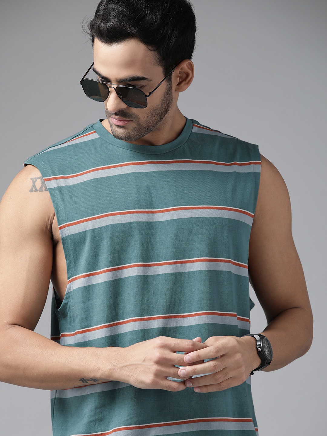 

Roadster Men Blue & Rust Orange Striped Pure Cotton T-shirt