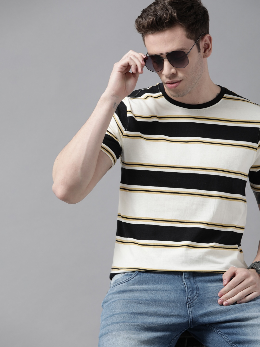 

Roadster Men Off White & Black Striped Pure Cotton T-shirt