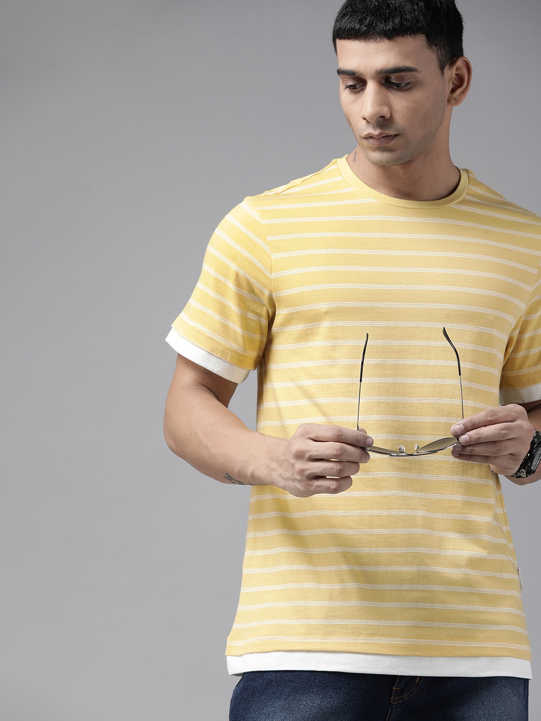 

Roadster Men Yellow & White Striped T-shirt