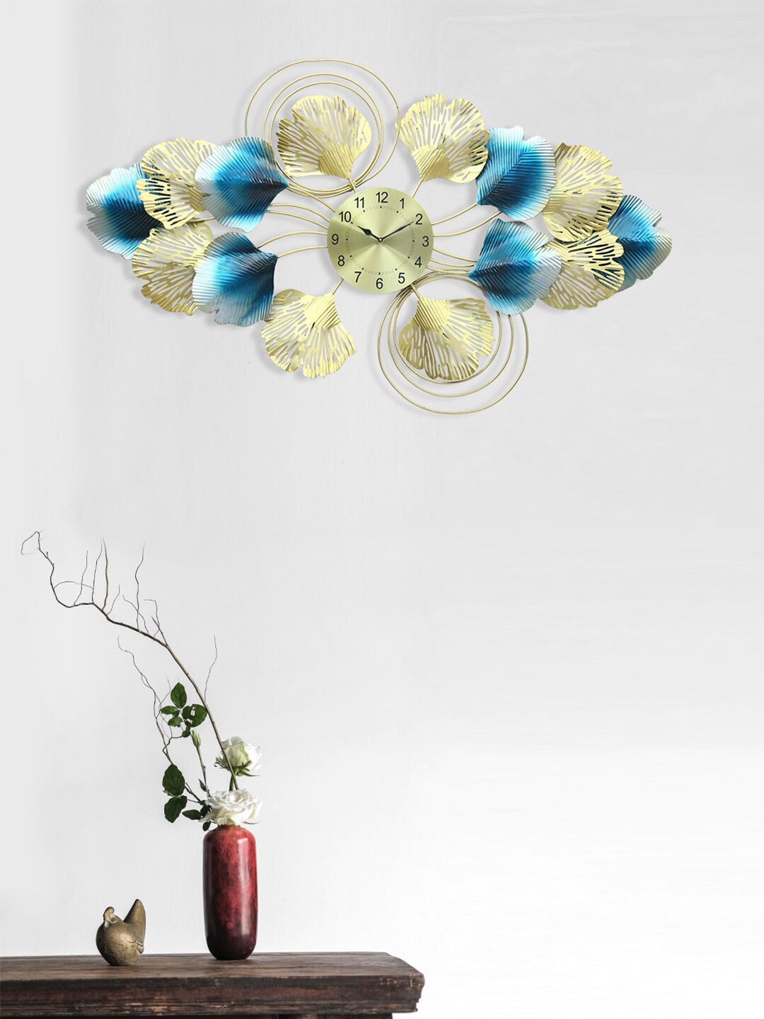 

Aapno Rajasthan Gold-Toned & Blue Embellished Floral Wall Clock