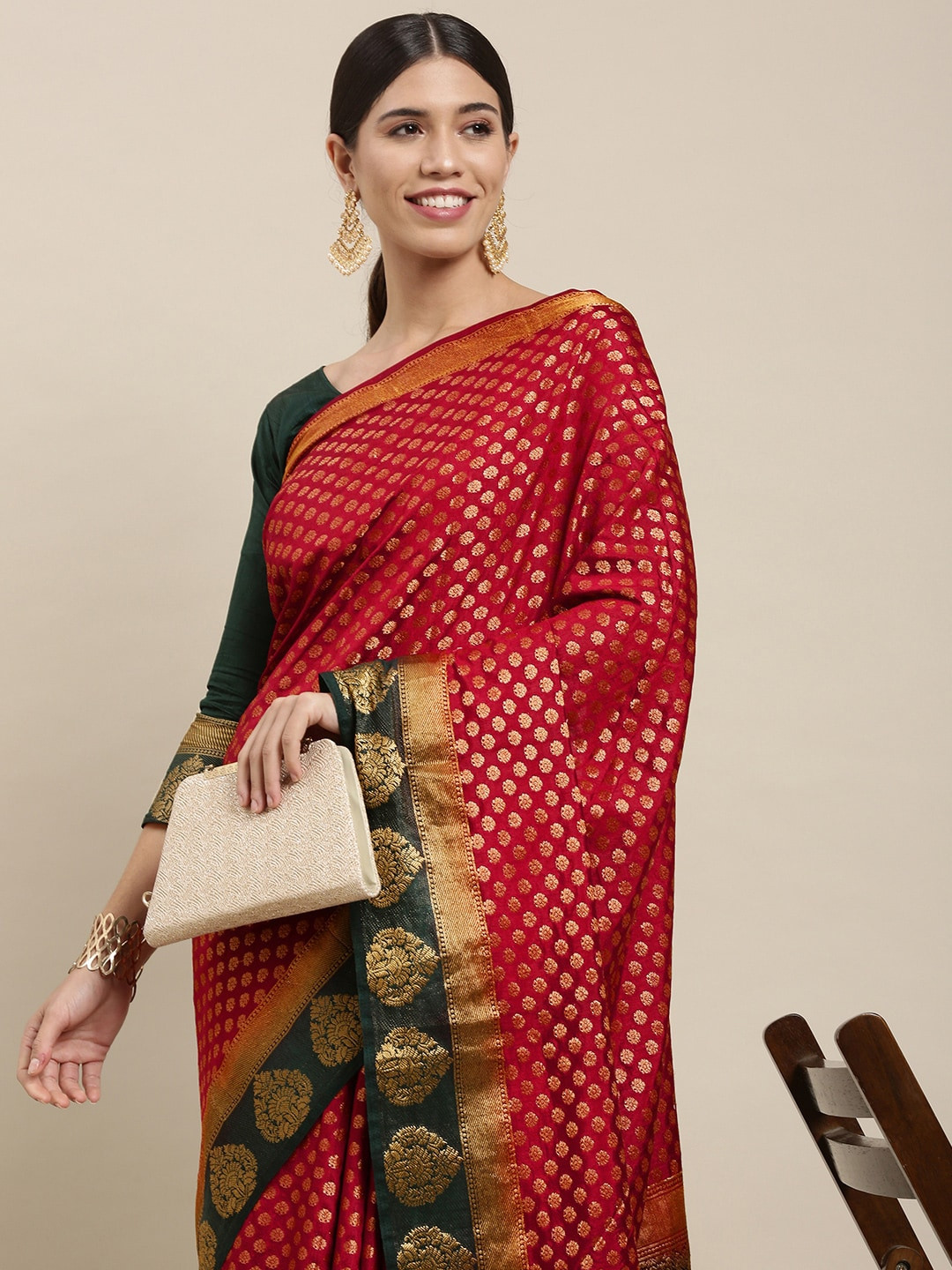 

Mitera Maroon & Gold Ethnic Motifs Zari Silk Blend Saree