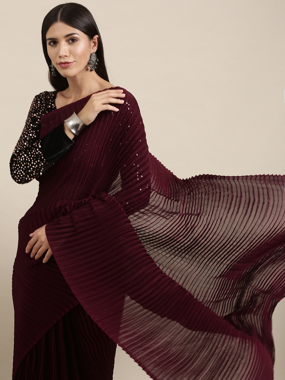 

Mitera Burgundy Solid Pleated Sequinned Saree