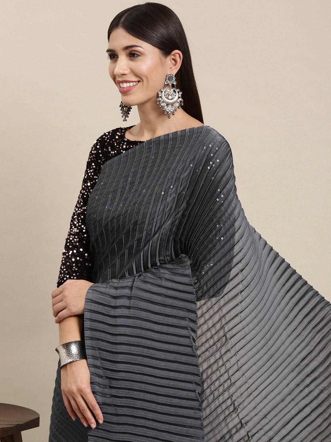

Mitera Grey Solid Pleated Sequinned Saree