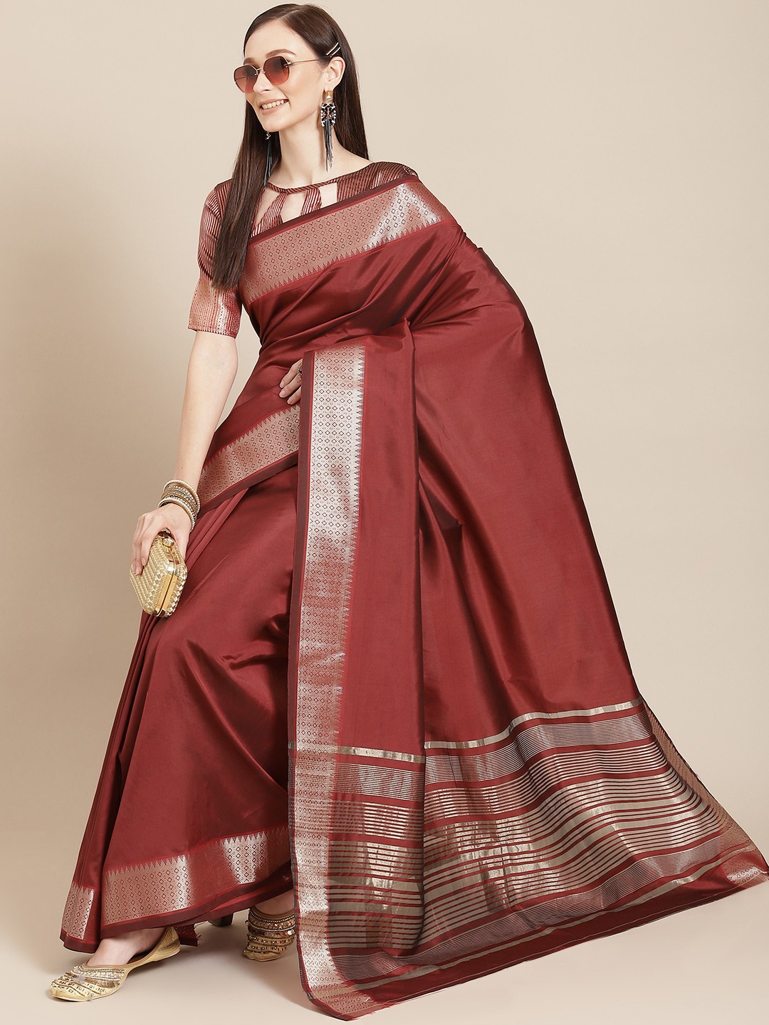 

KALINI Women Maroon & Golden Solid Saree