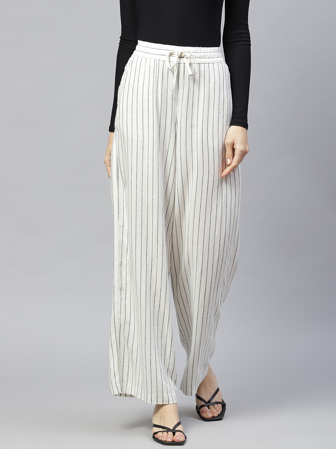 

Marks & Spencer Women Off White Striped Parallel Trousers